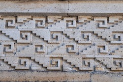 Zapotec geometric design stone fretwork (called grecas in Spanish) in the friezes at Mitla archeological site, Oaxaca, Mexico