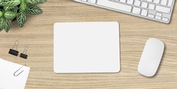 Mouse pad mockup. White mat on the table with props.
    
    - Image