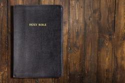 Black Holy Bible book on a desk
