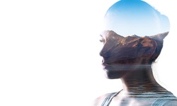 Double exposure of young woman and sunset background