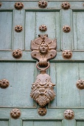 Antique Knocker on Turquoise Green Colored Wooden Door of Cusco Cathedral, Historic Site in Cuzco, Peru