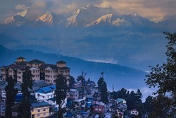 View of Darjeeling with Kanchenjunga in the background at sunrise. Beautiful  Himalayan landscape at Darjeeling, West Bengal, India near Nepal, Sikkim at the Indian Himalayas