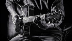 Music concept. Guitar acoustic. Play the guitar. Live music. Music festival. Instrument on stage, band. Electric guitar, guitarist, musician rock. Musical instrument. Guitars, strings Black and white