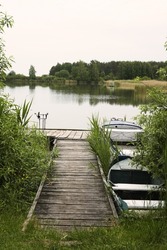 wooden pier on big lake in Europe, vertical view