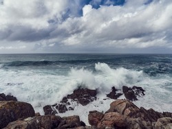 Waves Crashing Against the Rocks on the cliffs of Muxia, Costa da Morte, Galicia, Spain. This part of the coast is feared and very dangerous due to the strength and fierceness of the ocean.