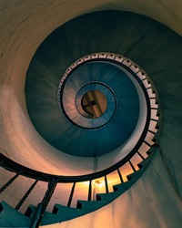 Spiral staircase of an old lighthouse. conceptual image of ascension, profitability, leading, success. Fine art.