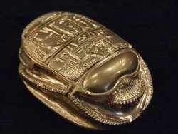 Egyptian style scarab isolated on a dark background