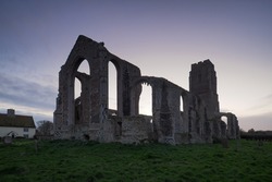 Covehithe Church at sunset where a smaller church sits within the ruins of an earlier and much larger church, Suffolk, UK