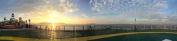 Panorama view on backdesk from helideck in seismic vessel ship during sunset in Andaman Sea for oil and gas survey with sky background sunset and blue sky