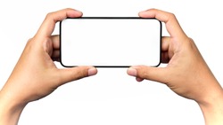Human hand holding a virtual cell phone is playing game or watching movie on screen, isolated on white background.