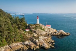 Aerial view of historic landmark Point Atkinson Lighthouse by day in West Vancouver, British Columbia, Canada.