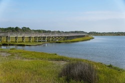 The wooden boardwalk by the bay near Assateague Island, Maryland, U.S.A