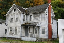 An abandoned and rundown white house near Watkin Glens, Upstate New York