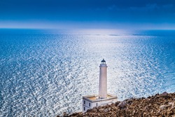 The lighthouse of Cape of Otranto in Apulia standing on hard granite rocks is the most easterly point of Italy and marks the meeting of the Ionian Sea and the Adriatic Sea