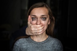 Crying woman after beating by her husband. Female violence concept. Help for women suffering from domestic, woman violence. Women's rights and gender equality