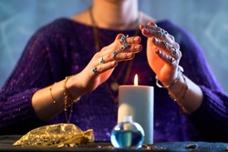 Fortune teller woman using burning candle flame for spell, witchcraft, divination and fortune telling. Spiritual esoteric occult magic ritual illustration