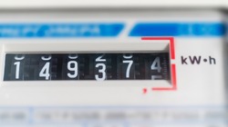 macro view of electricity watt meter, kilowatt calculator counter at home, savings economy