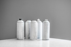 white abstract spray paint cans, aerosol art concept