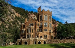 An old castle in the mountains. Mountain mansion. Mansion in mountains. Castle mansion