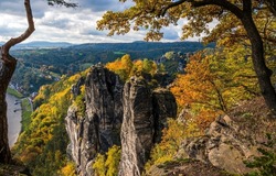 Autumn in the mountain forest. Beautiful mountain landscape in autumn. Autumn mountain view. Mountains in autumn season