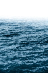Royal blue atlantic ocean. Deep blue ocean water wave. Navy blue aqua. Mystic fog. Marine landscape. Sea view. Wet surface. Pacific ocean. Aqua background. Blue ocean background.