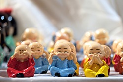 Deaf and blind toy monks, the three wise monks