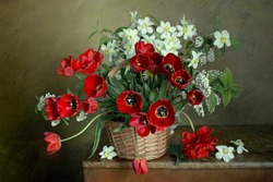 Spring flowers in a bouquet.Still life with tulips and daffodils in a vase.