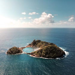 Small tropical island from above / drone shot, ocean around, laguna inside, paradise, Azores islands, Portugal