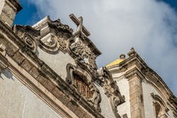 Detail of the cross and carvings in colonial style of Senhor do Bonfim church in Salvador, Bahia, Brazil