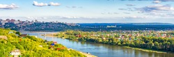 View from observation deck to residential districts of Ufa and Belaya river in summer evening at sunset. Beautiful cityscape, popular view of Ufa city, capital of Bashkiria
