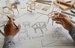 Designer sketching drawing design development product plan draft chair armchair Wingback  Interior furniture prototype manufacturing production. designer studio concept .                           