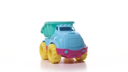 Toy car isolate on white background. Toy truck turquoise blue yellow and red color on turntable spin.