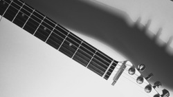 white electro guitar . white background . black and white                               