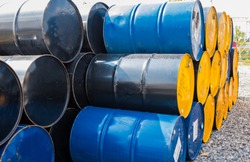 Industry oil barrels or chemical drums stacked up.chemical tank.container of  barrels of hydrocarbons.Chemical reagents.hazardous waste of black and blue tank oil.