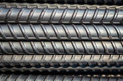 close up steel bar or steel reinforcement bar in the construction site ,steel rods bars can use for reinforce concrete.Background texture of steel rods used in construction to reinforce concrete.