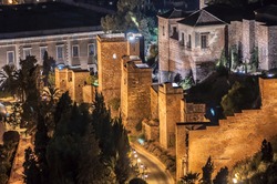 Night view of the Alcazaba, old muslim castle, in Malaga city, Spain