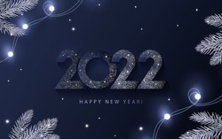 Happy New Year 2022 beautiful sparkling design of numbers on dark blue background with lights, pine branches and shining falling snow. Trendy modern winter banner, poster or greeting card template