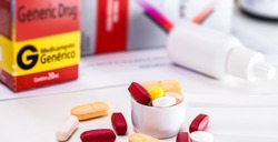 generic medicine, closeup of patent free medicine pills and capsules, cheapest medicine