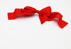 A red ribbon on a white background