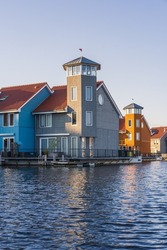 Colorful houses beside the lake at dusk in Groningen, Nehterlands
