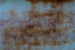 Grunge worn metal texture with elements of rust and cracks. Peeling paint on the surface. Blue surface coating