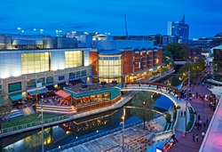 Aerial view of the 'Oracle' shopping centre illuminated at dusk in Reading, Berkshire uk