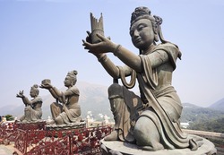 Row of Buddhas at the Tian Tan Buddha statue in Lantau Island, Hong Kong
