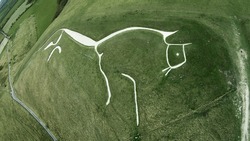 Aerial drone shot of the historic Uffington White Horse Chalk figure in Oxfordshire