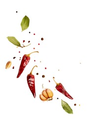 Flying set of colorful spices peppers, chili, garlic, laurel leaf, herbs in the air isolated on white background. Food and cuisine ingredients top view, with copy space. 