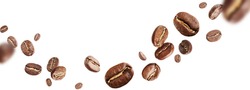 Dark aromatic roasts beans coffee levitate on white background with copyspace. 