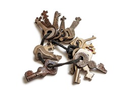 Bunch of old, small keys from lost locks on a black string, isolated on a white background
