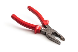 Old combination pliers with red insulation handles, isolated on a white background
