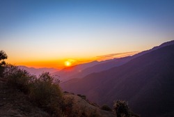 Mountains layered views from the top of Nag Tibba base camp located in Dehradun Uttarakhand India. Sunset view of the natural beauty in Nag Tibba trek located in Dehradun Uttarakhand India. - Image