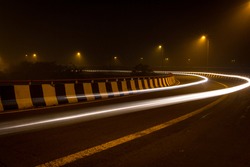 Night photography of the road transportation in the capital city of New Delhi, India. Long or Light exposure photography in New Delhi, India. Freeway in low light photography Delhi Photography - Image